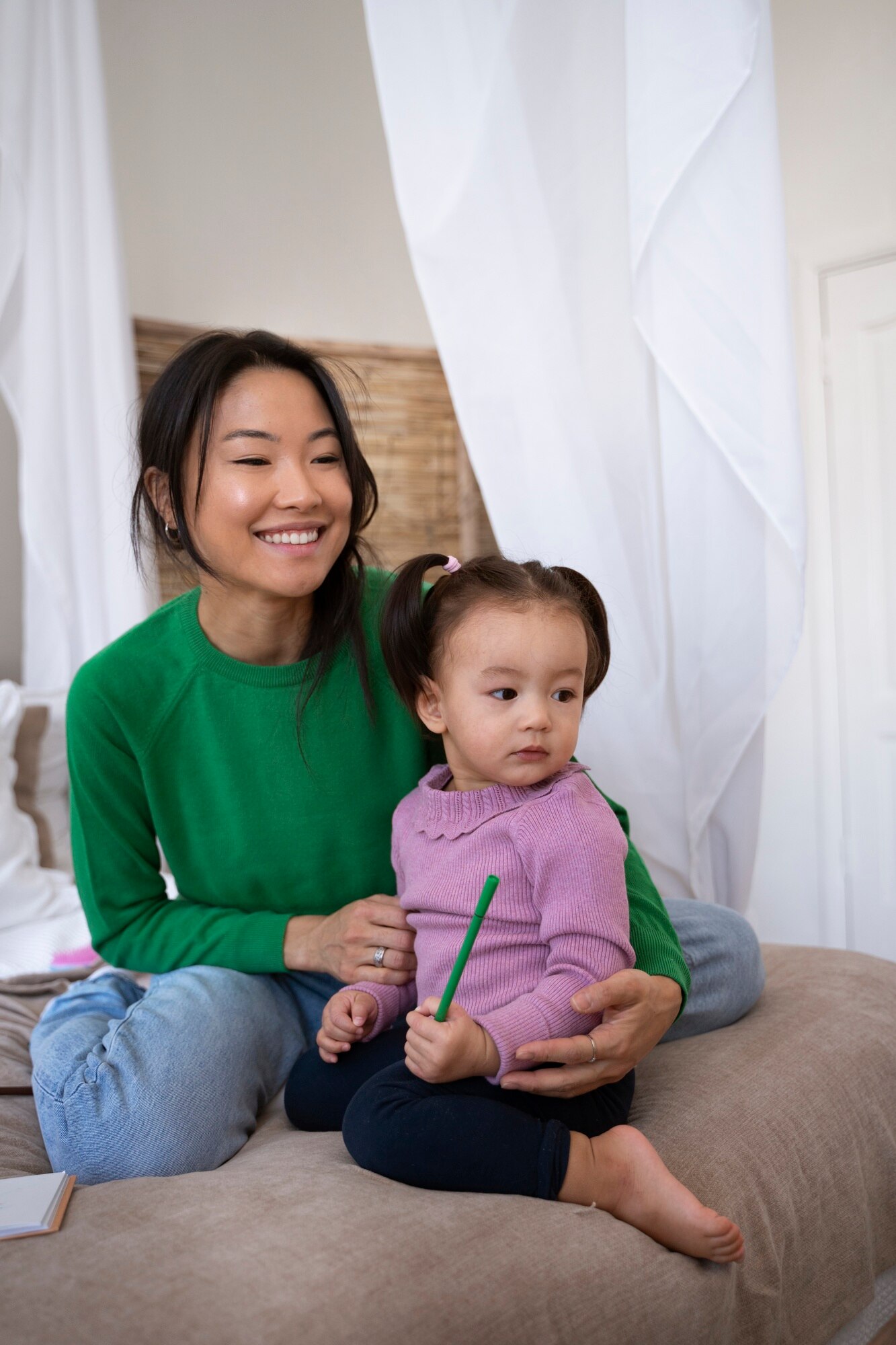 6834c68b176ca_asian mother daughter spending time together home_23 2150259917